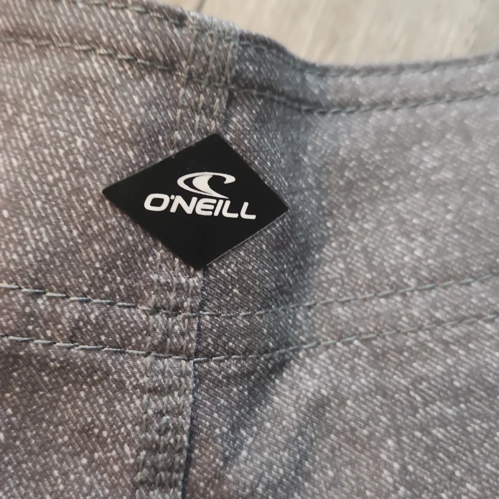O'Neill Gray and Blue Board Shorts with Tropical Print